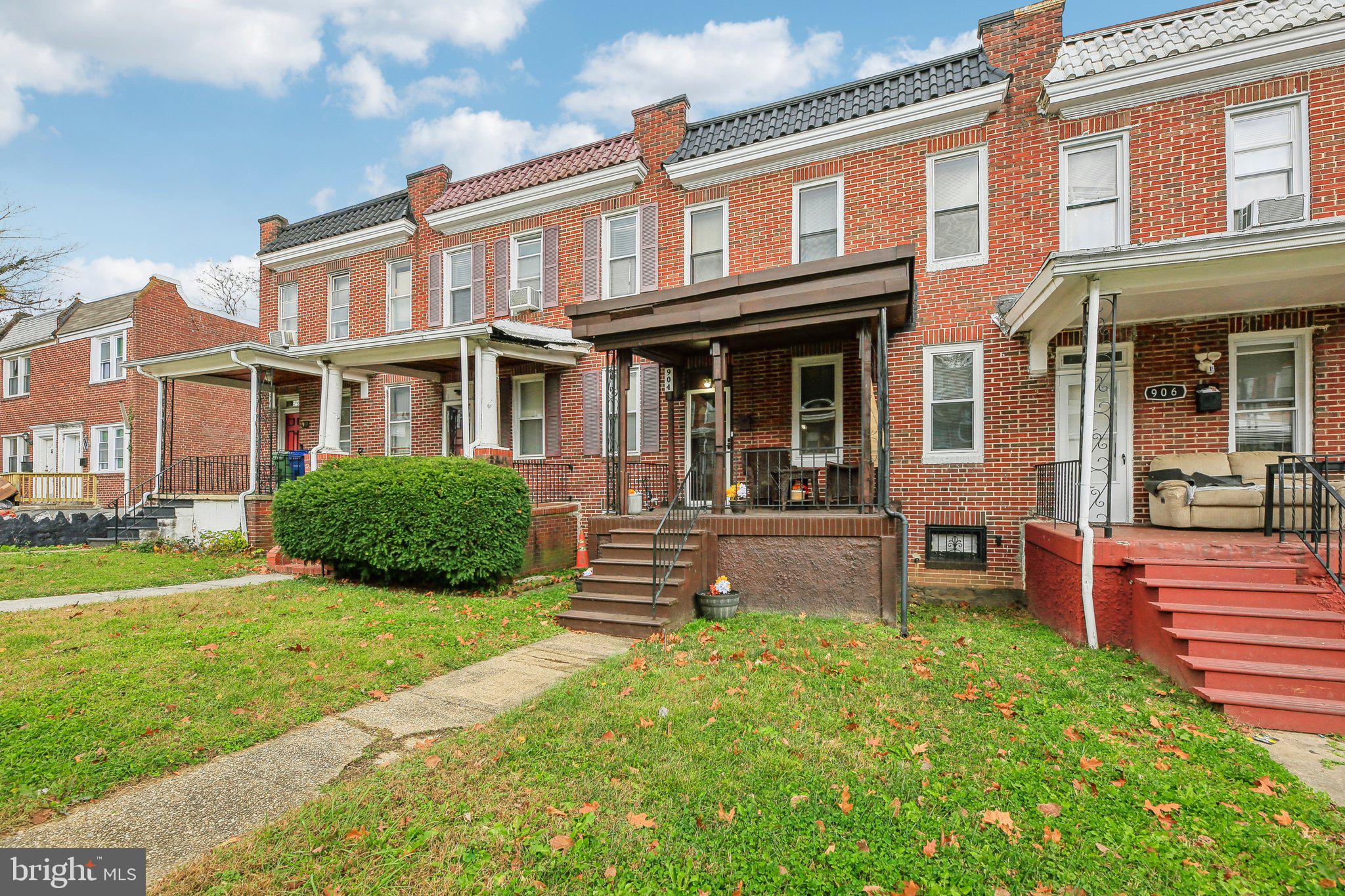 904 North Rosedale Street Baltimore, MD 21216 - Photo 4 of 38 a view of a house with a yard