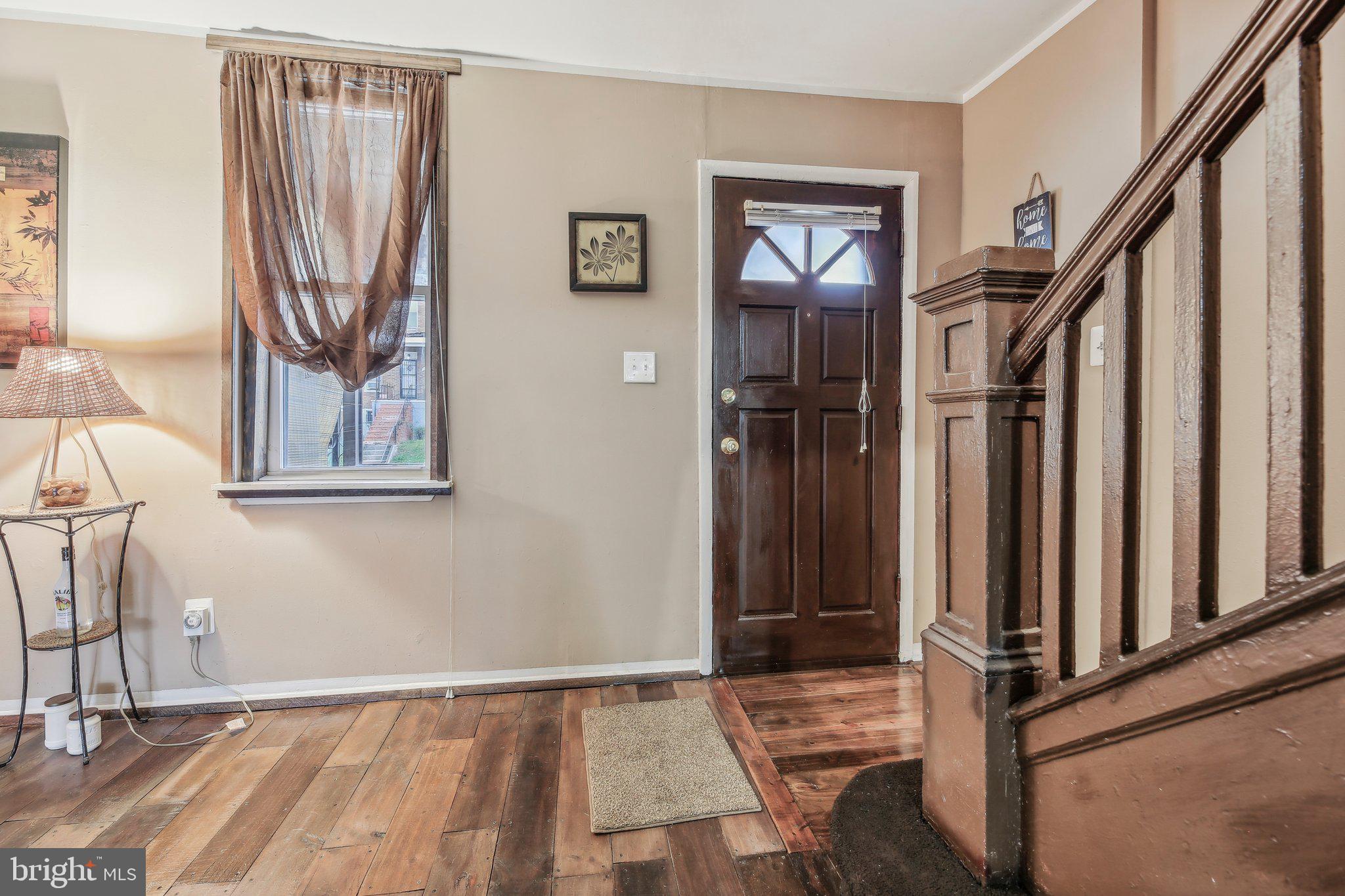 904 North Rosedale Street Baltimore, MD 21216 - Photo 6 of 38 a view of front door with wooden floor