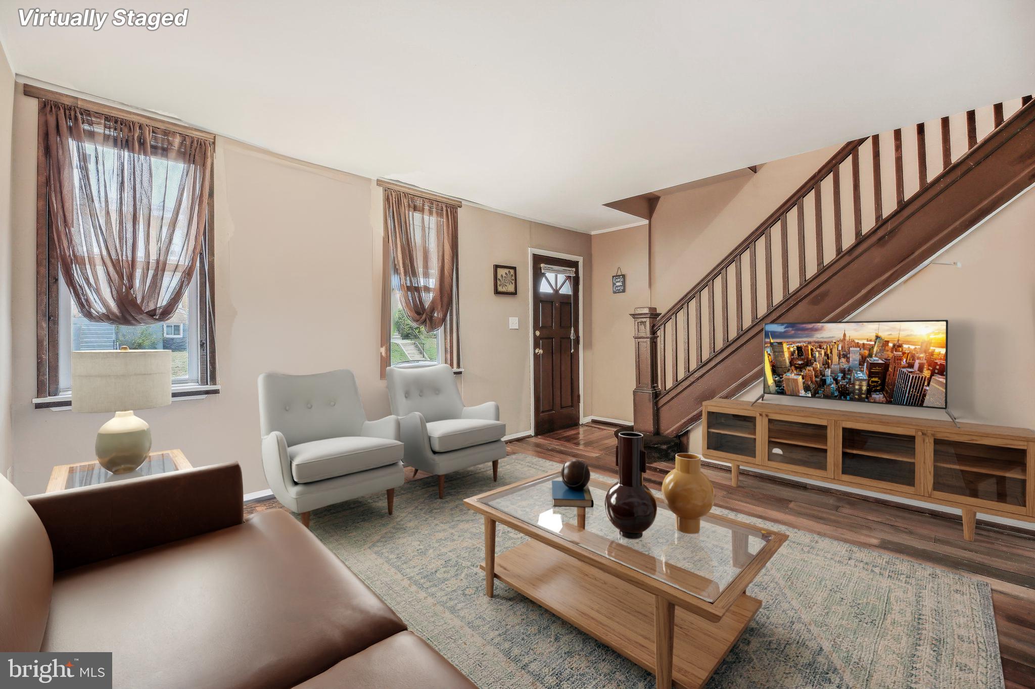 904 North Rosedale Street Baltimore, MD 21216 - Photo 7 of 38 a living room with furniture gym equipment and a rug