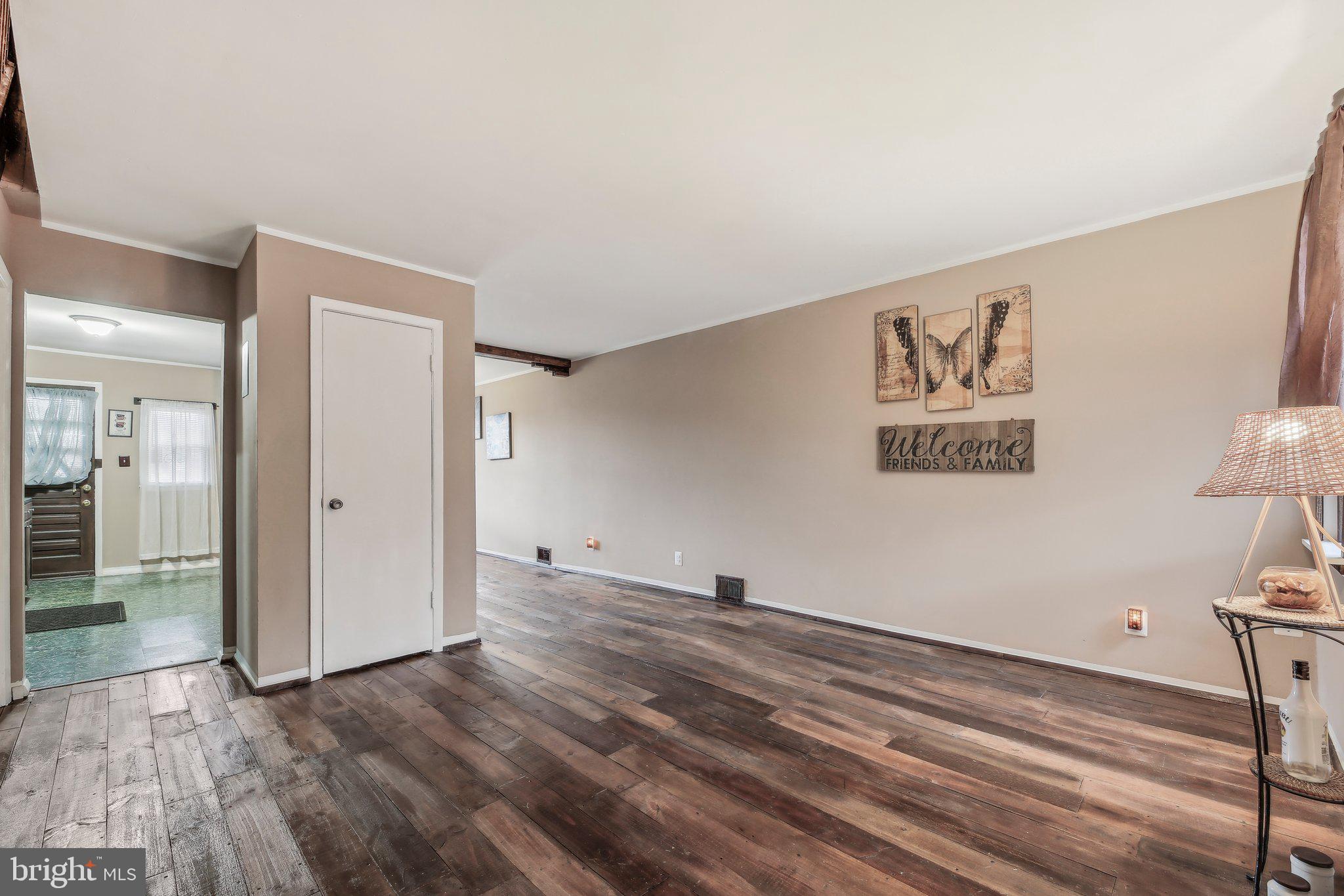 904 North Rosedale Street Baltimore, MD 21216 - Photo 9 of 38 a view of a room with wooden floor