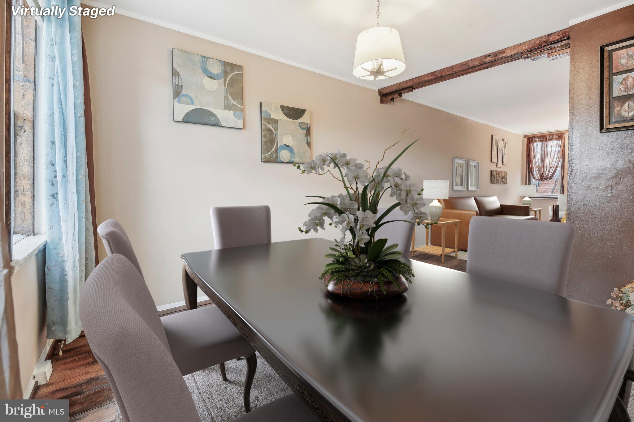 904 North Rosedale Street Baltimore, MD 21216 - Photo 10 of 38 a view of a dining room with furniture window and wooden floor