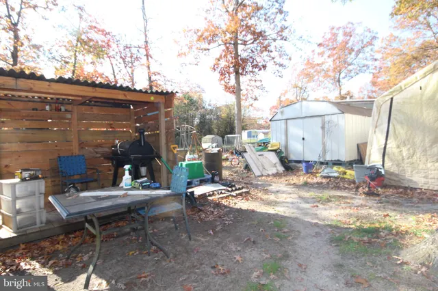 a view of road with snow on the roadside