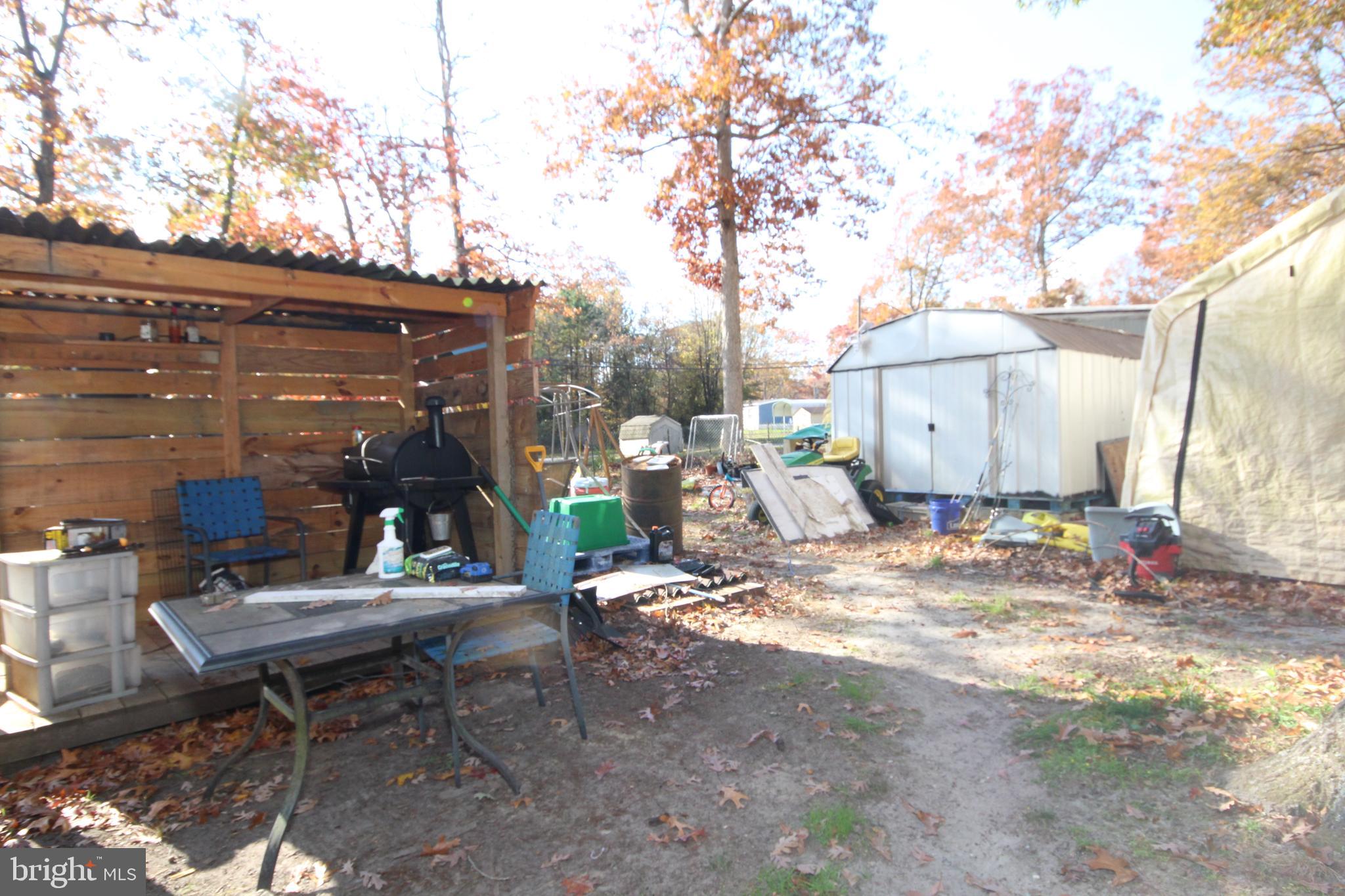 459 Mistle Road Millville, NJ 08332 - Photo 19 of 24 a view of outdoor space yard deck patio and fire pit
