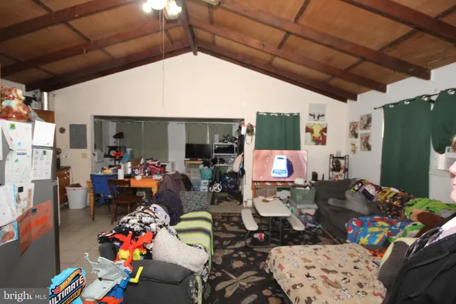 a room with furniture and a ceiling fan