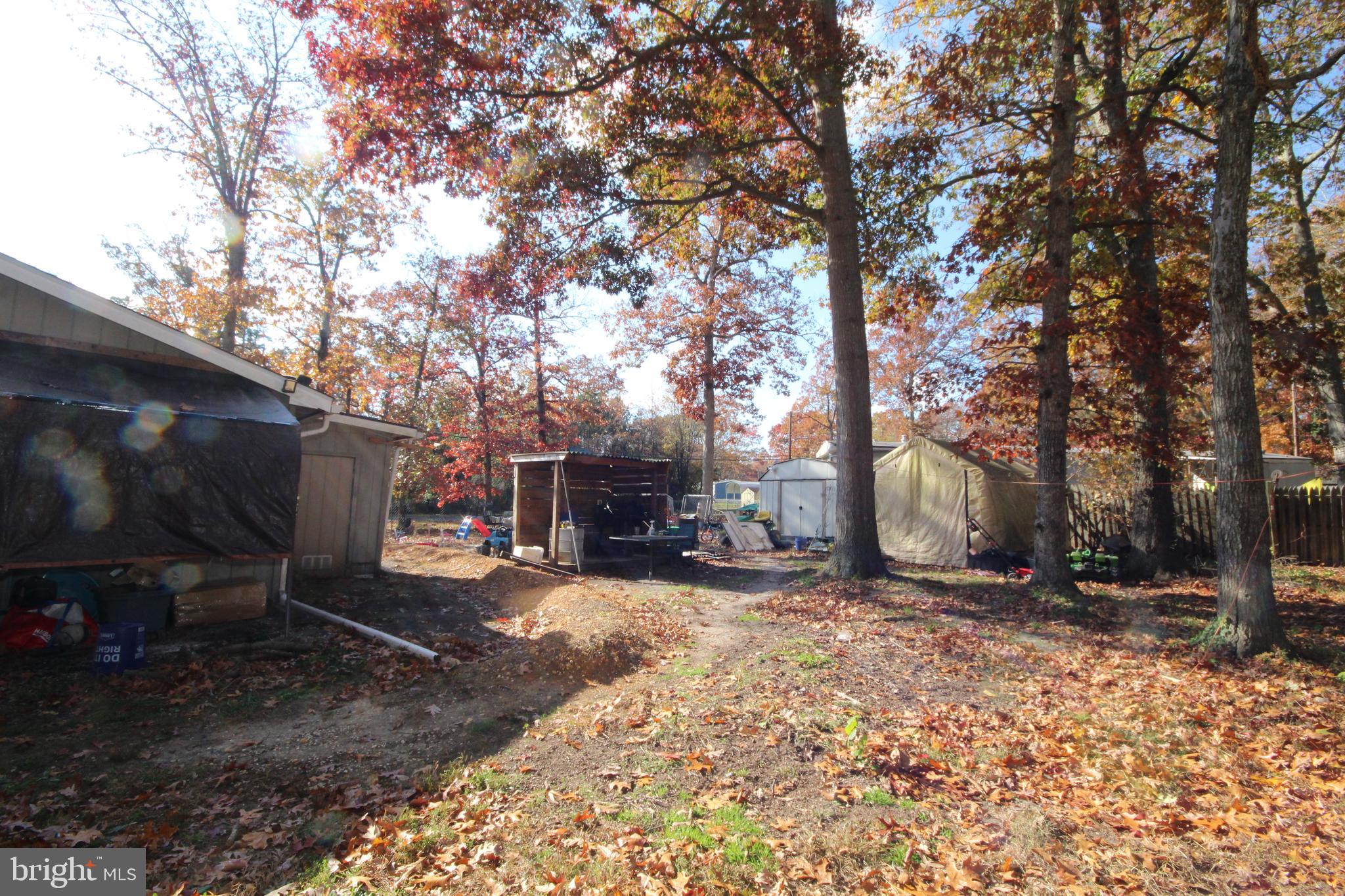 459 Mistle Road Millville, NJ 08332 - Photo 21 of 24 a view of a backyard with table and chairs and a fire pit