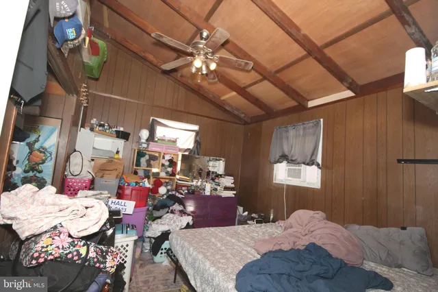 a bed room with a bed and a chandelier