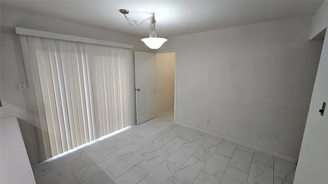 a view of a chandelier in hallway