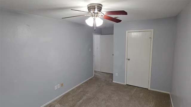a view of a chandelier fan in a room