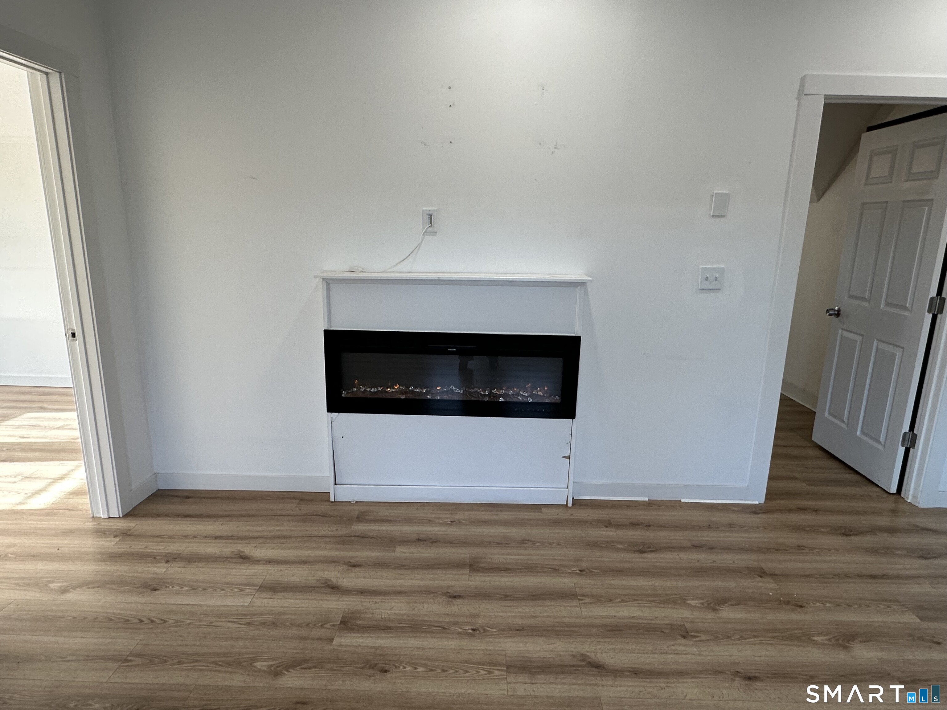 27 East 9th Street Derby, CT 06418 - Photo 11 of 22 a view of an empty room with wooden floor and a window