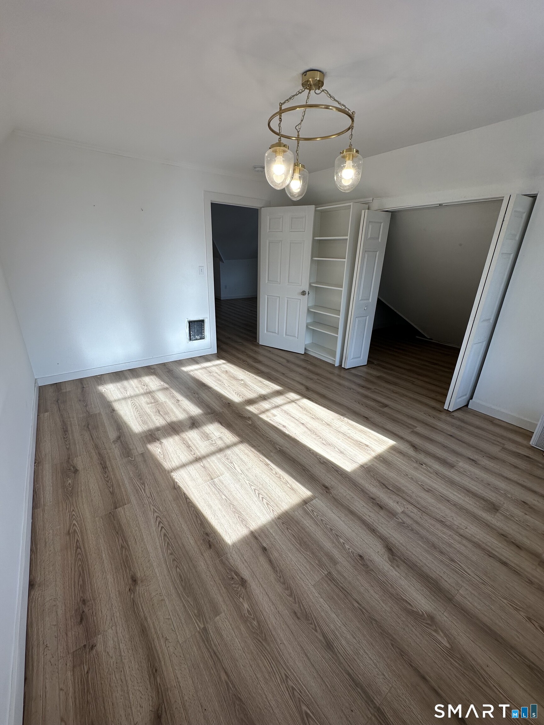 27 East 9th Street Derby, CT 06418 - Photo 19 of 22 a view of empty room with wooden floor