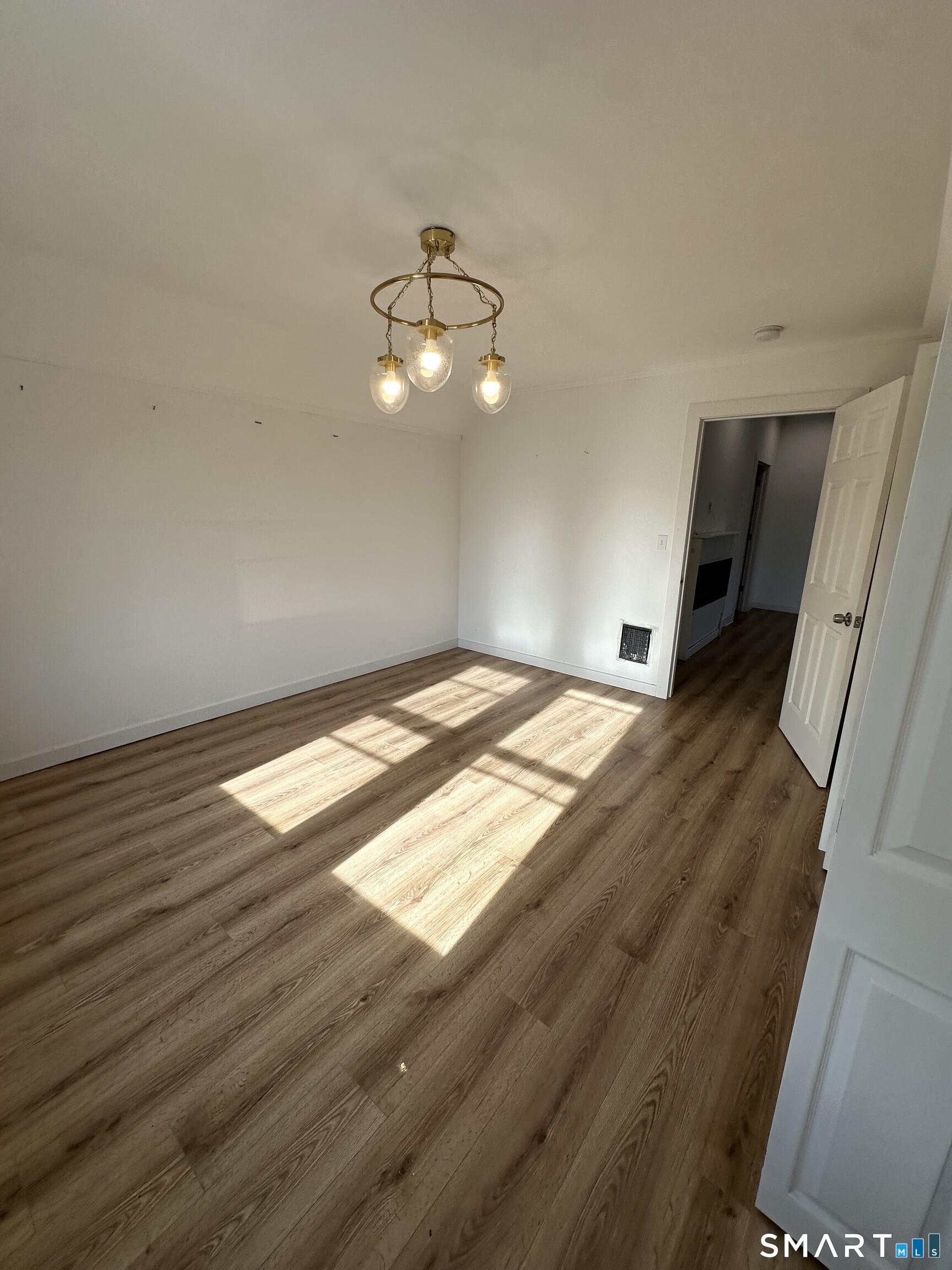 27 East 9th Street Derby, CT 06418 - Photo 20 of 22 wooden floor in an empty room with a window