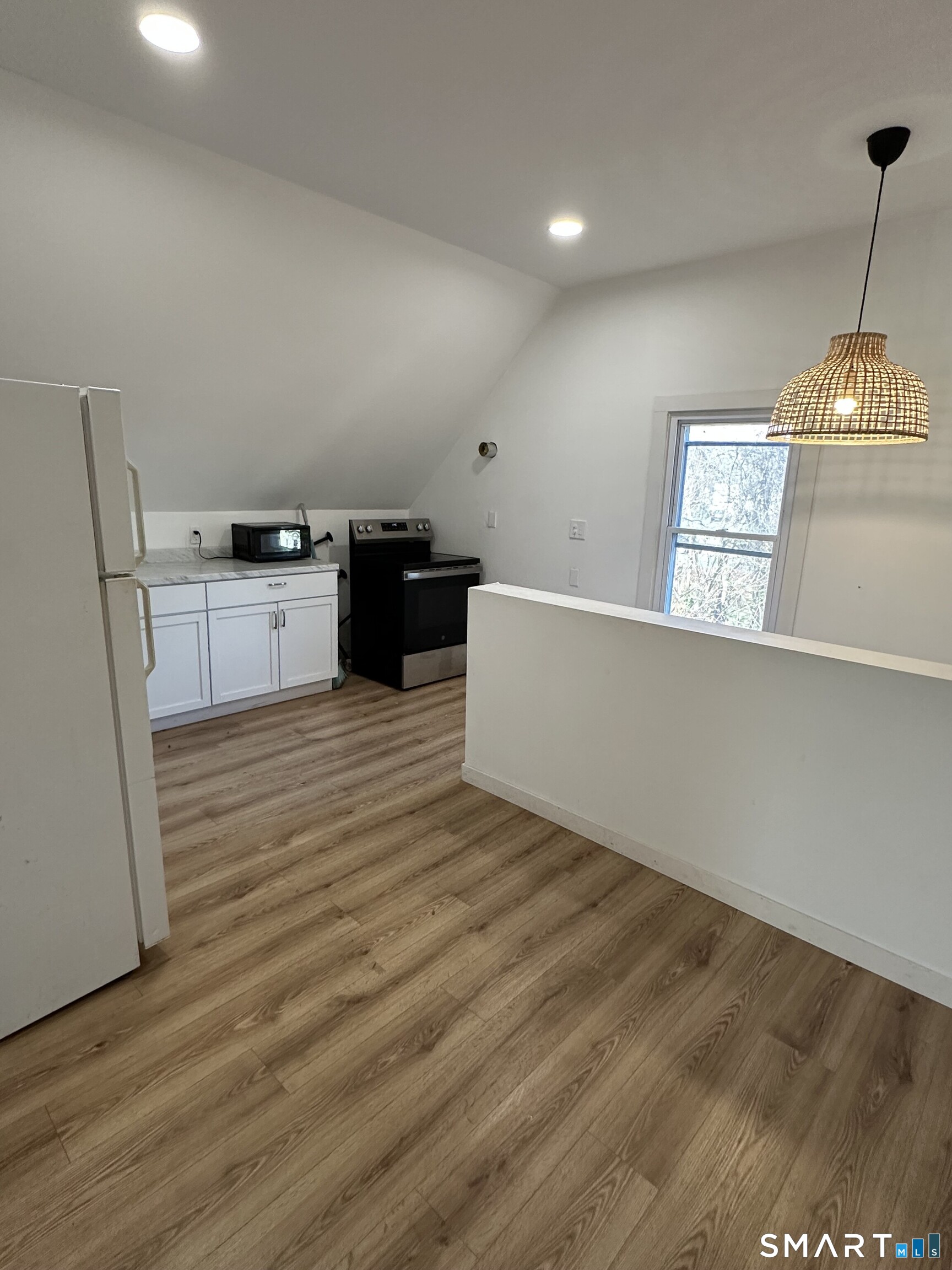 27 East 9th Street Derby, CT 06418 - Photo 6 of 22 a living room with furniture and a wooden floor
