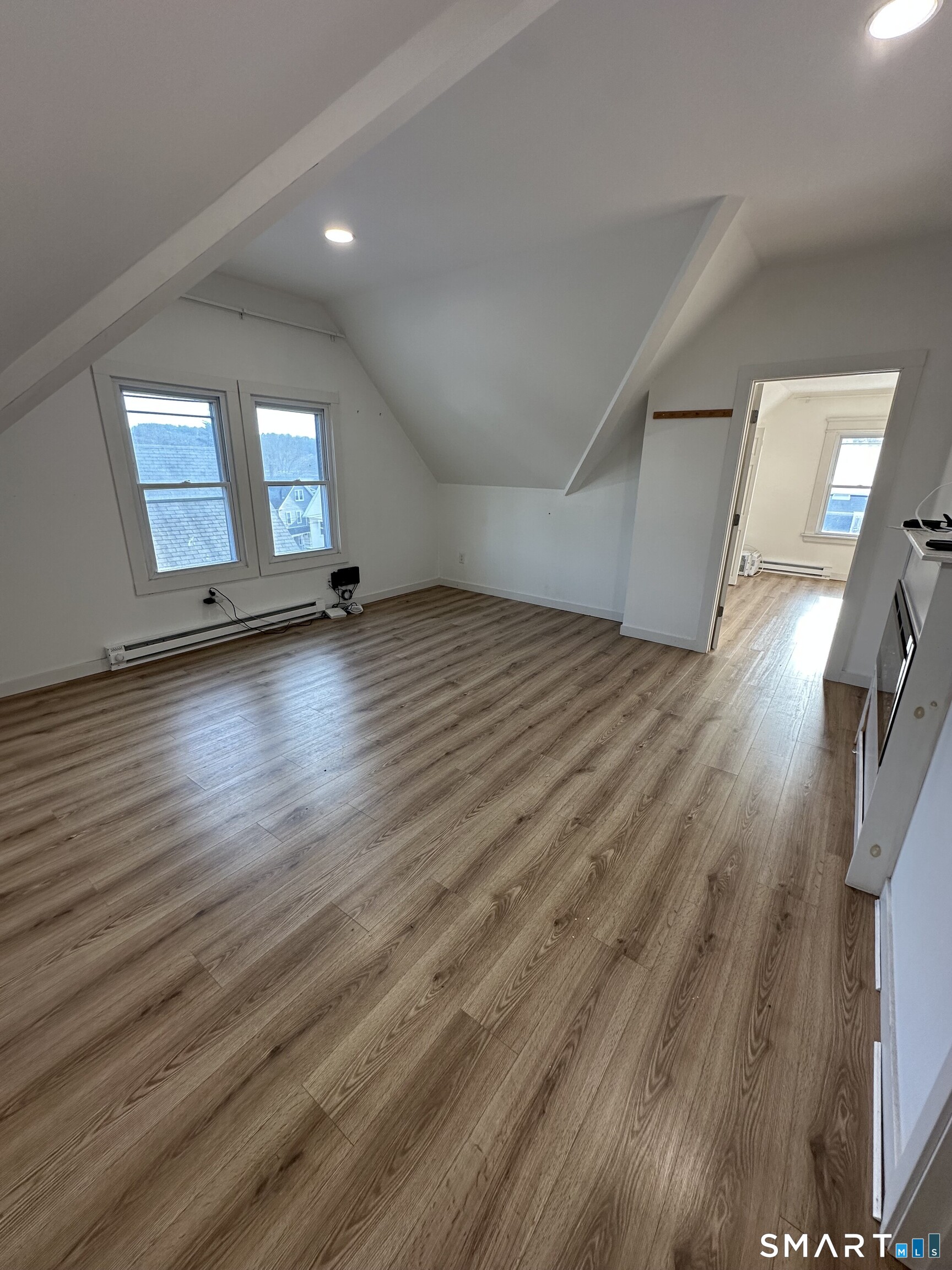 27 East 9th Street Derby, CT 06418 - Photo 9 of 22 wooden floor in an empty room with a window