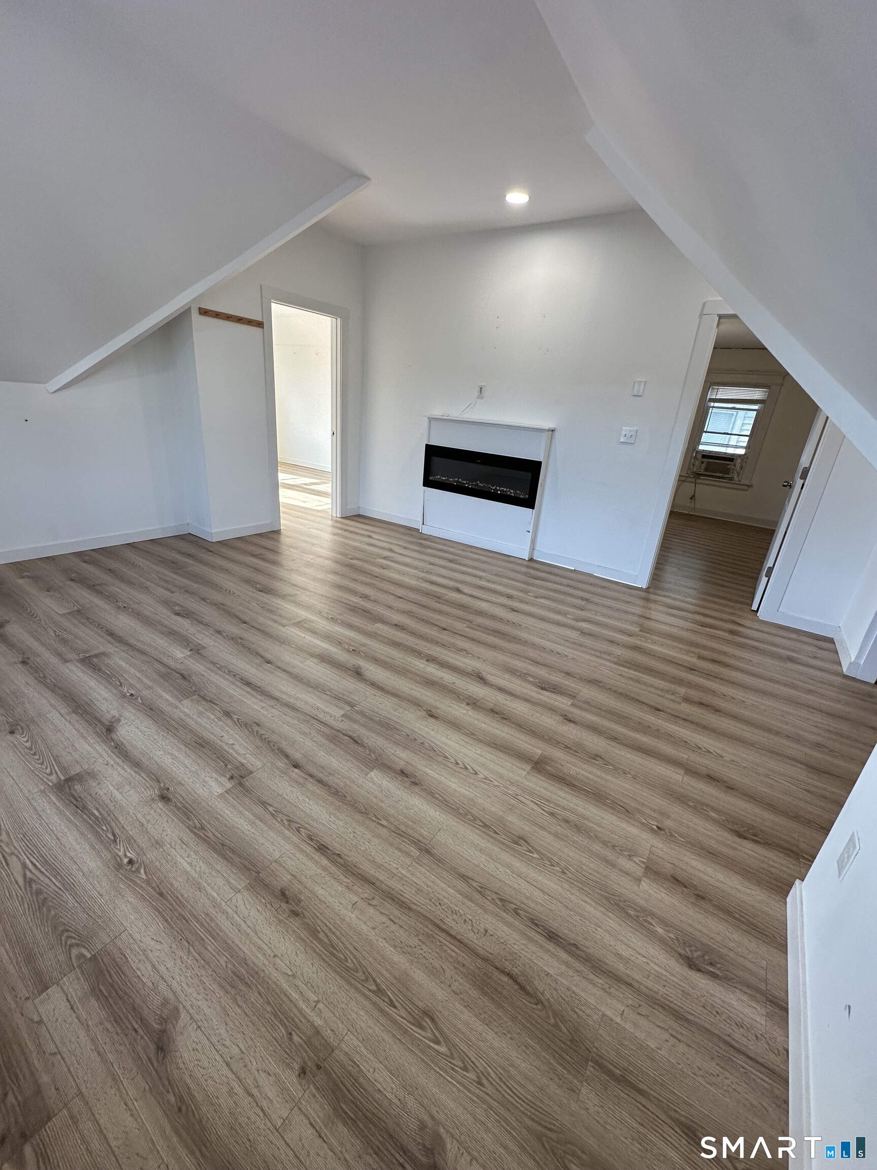 27 East 9th Street Derby, CT 06418 - Photo 10 of 22 a view of empty room with wooden floor