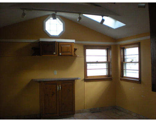 81 White Street Springfield, MA 01108 - Photo 4 of 4 a view of a livingroom with wooden floor and a window