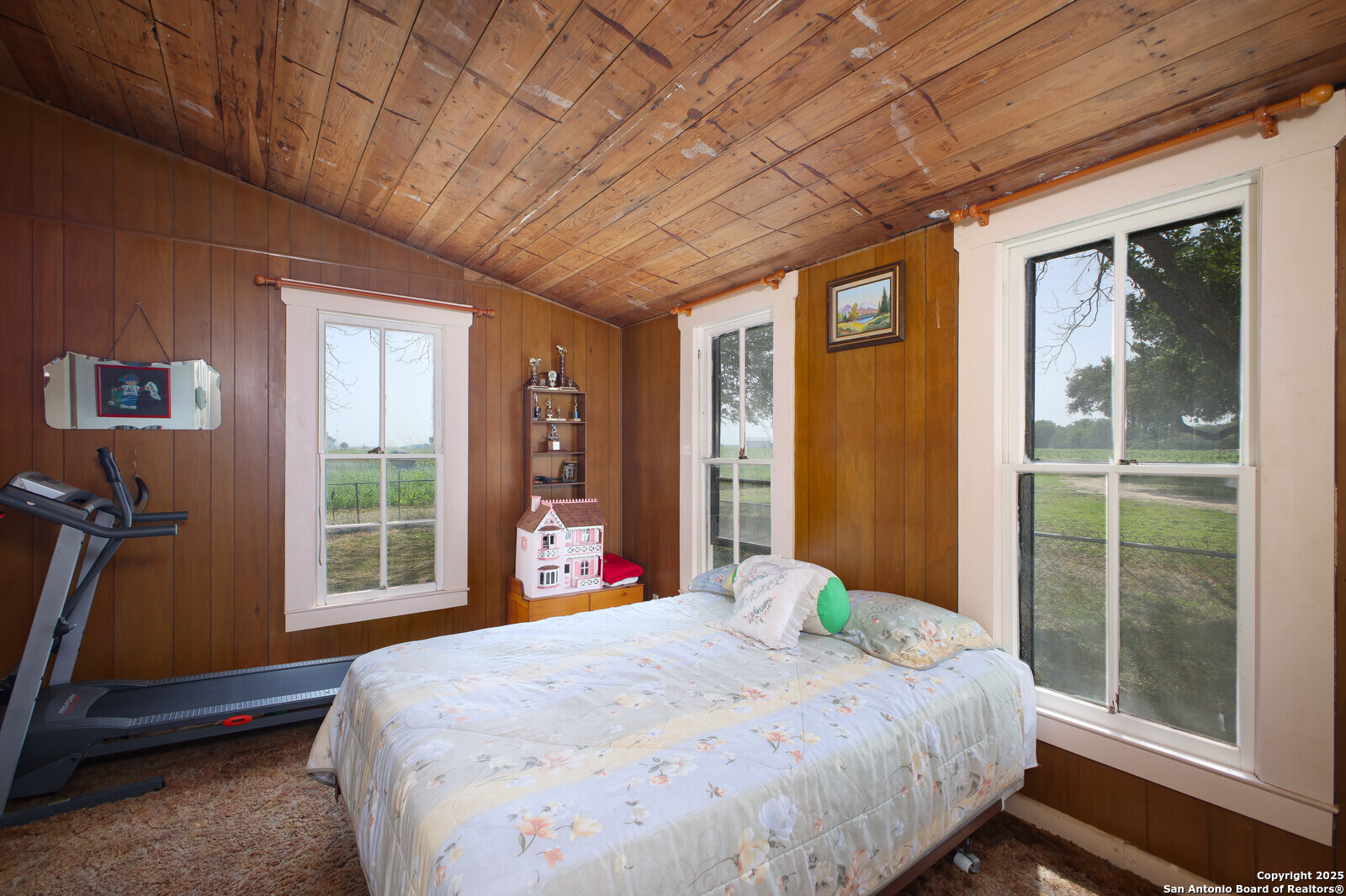 4901 Lower Seguin Road Cibolo, TX 78108 - Photo 23 of 41 a bed sitting in a bedroom next to a window