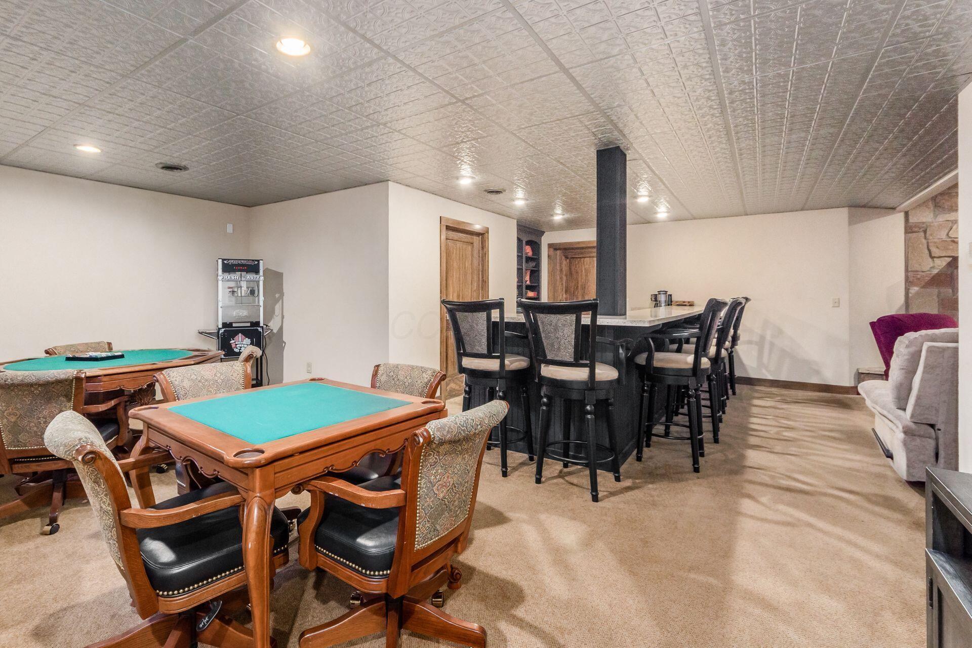 16187 Kreashbaum Road Rockbridge, OH 43149 - Photo 39 of 66 Gaming areas, bar area, multiple storage and utilities. Space for wine room conversion.