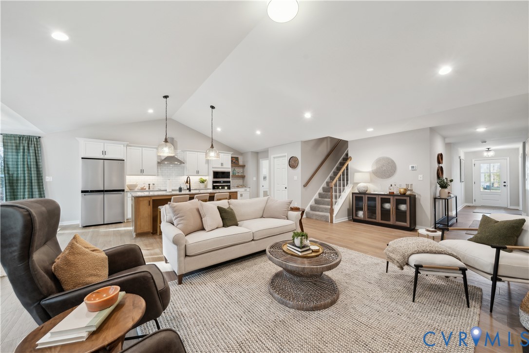 535 Wendenburg Terrace, Unit MODEL Aylett, VA 23009 - Photo 7 of 31 Living area with vaulted ceiling, stairs, light wo