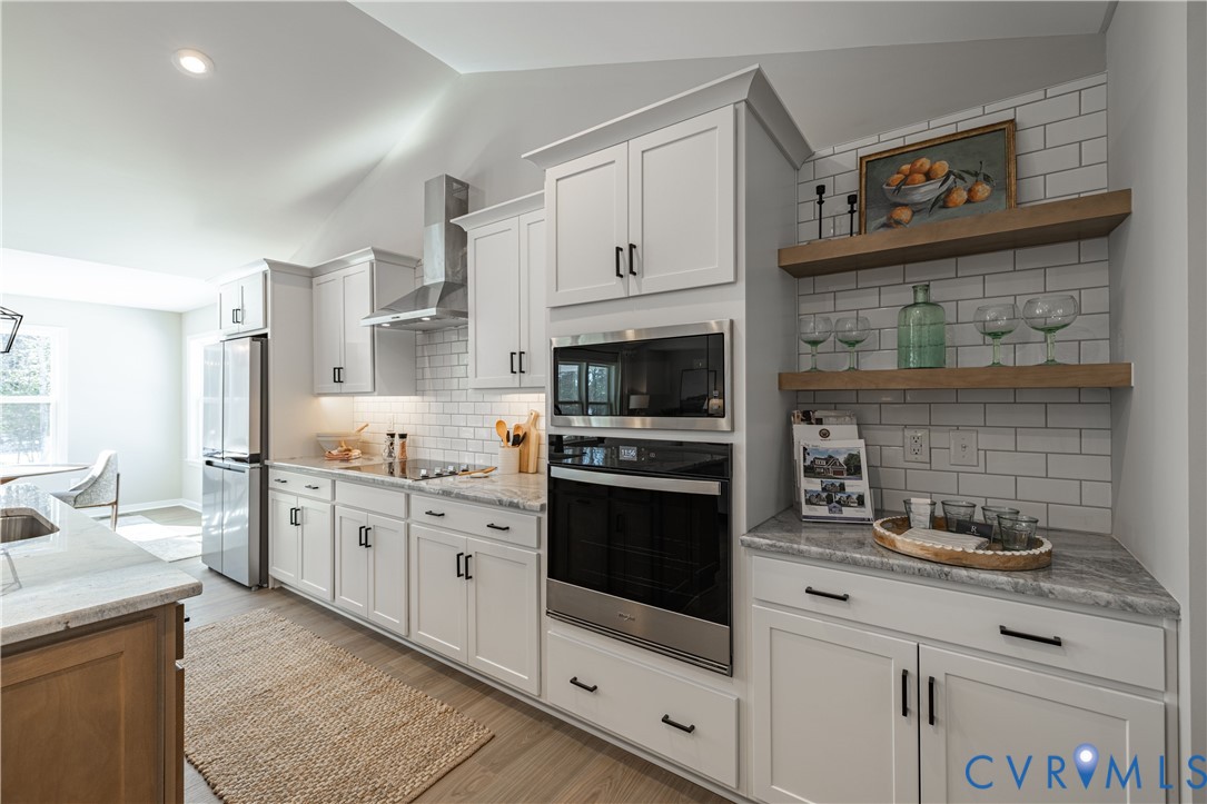 535 Wendenburg Terrace, Unit MODEL Aylett, VA 23009 - Photo 9 of 31 Kitchen with stainless steel appliances, wall chim