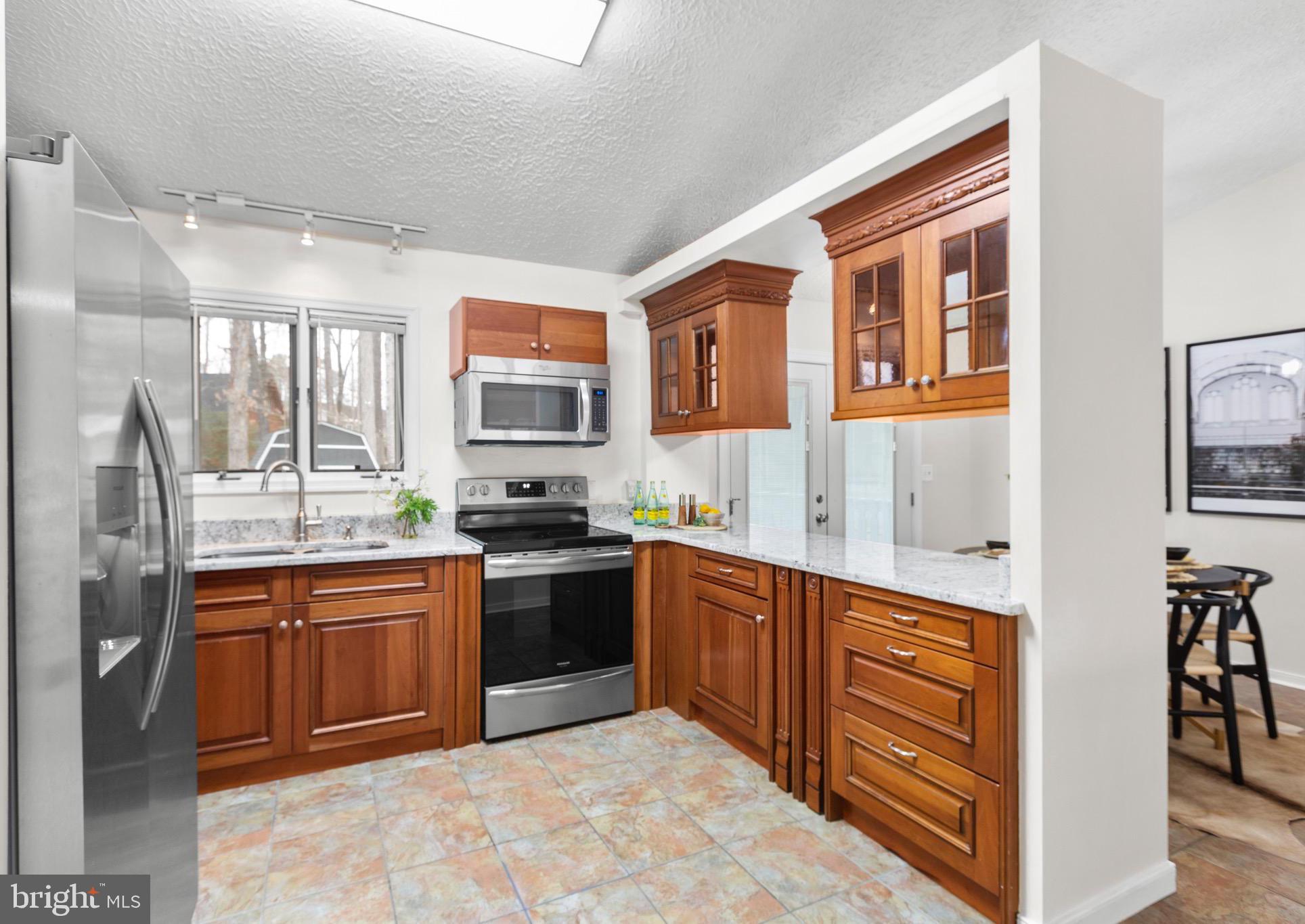 915 Kent Drive Ruther Glen, VA 22546 - Photo 16 of 42 Kitchen with Granite and SS Appliances
