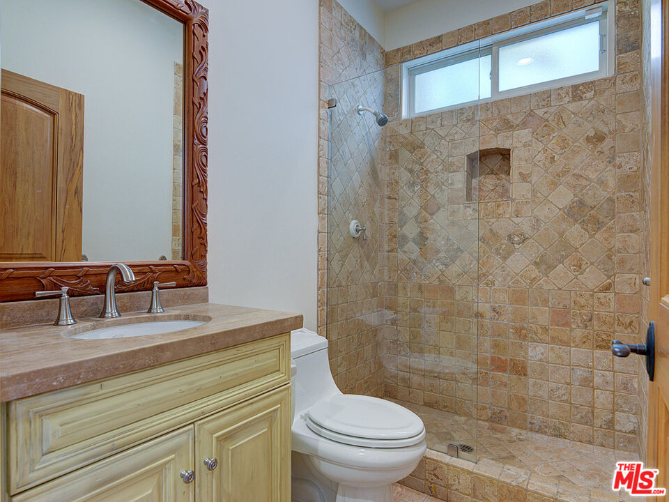 5003 Roma Court Venice, CA 90292 - Photo 18 of 34 a bathroom with a sink a toilet and shower