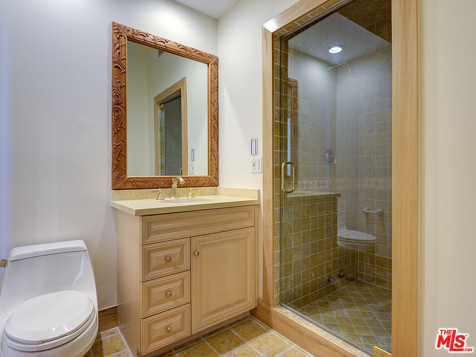 5003 Roma Court Venice, CA 90292 - Photo 25 of 34 a bathroom with a toilet a sink and shower