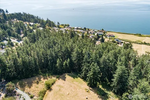 a view of a lake with a building in the background