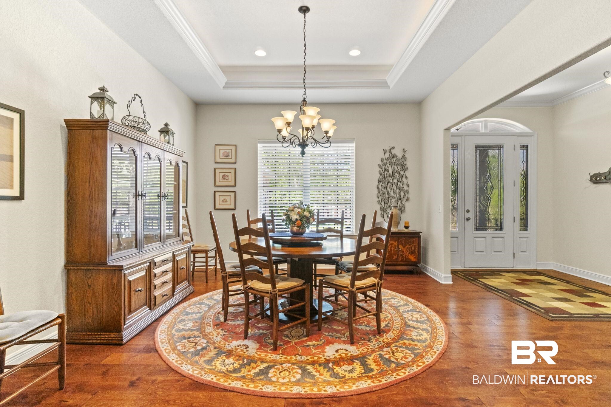 8664 Foxtail Loop Pensacola, FL 32526 - Photo 6 of 64 Dining area featuring a chandelier, wood finished floors, a tray ceiling, crown molding, and recessed lighting