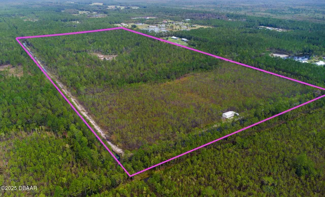 a view of a lush green outdoor space with a lake view and mountain view