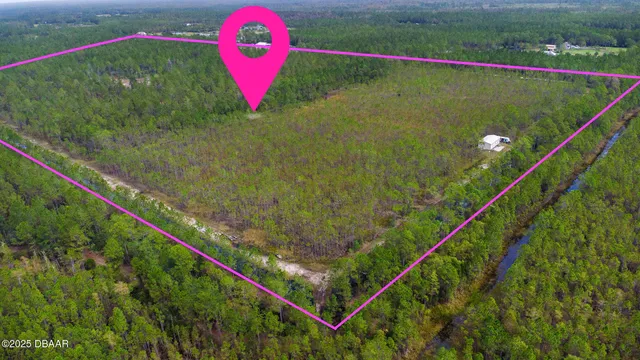 a view of a lake with a yard