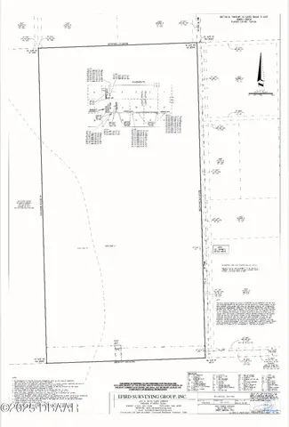 a view of a lake with a yard