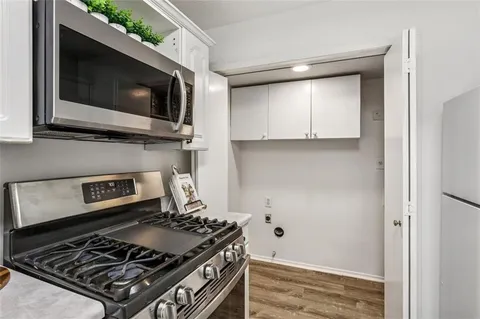 a kitchen with a stove and a microwave
