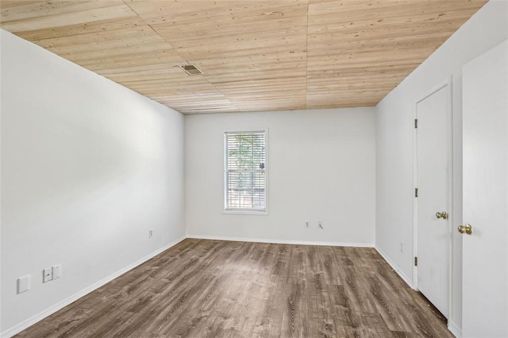 1601 Countryside Place Smyrna, GA 30080 - Photo 17 of 27 a view of empty room with wooden floor and fan