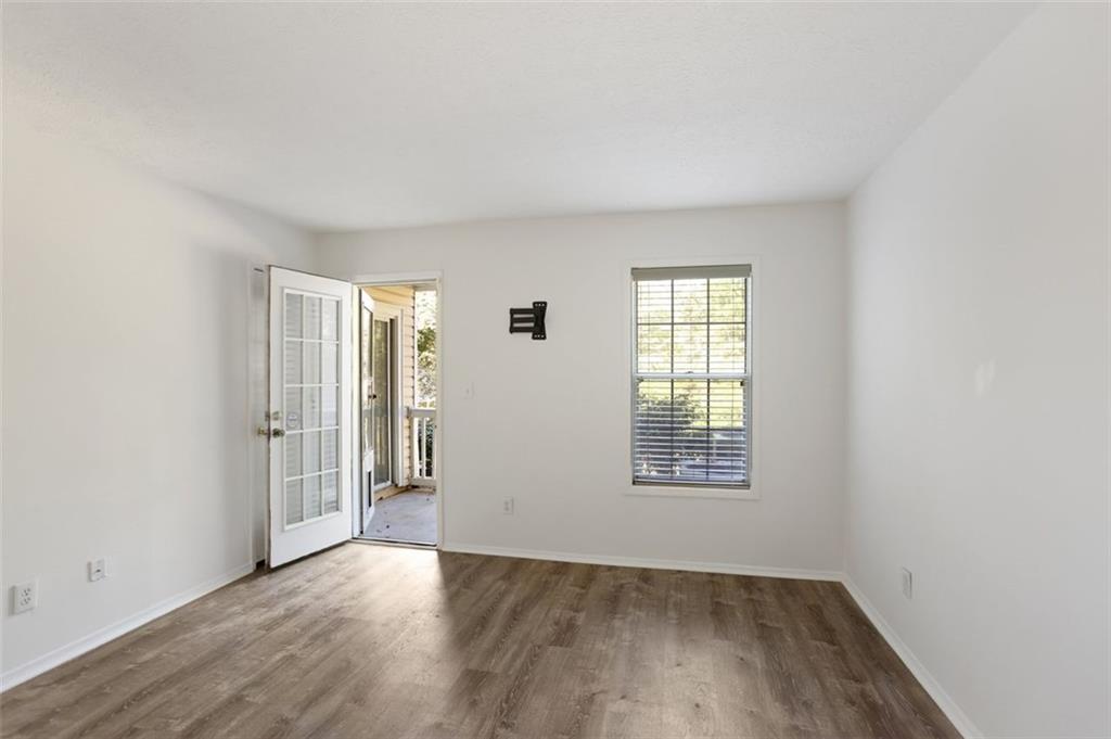 1601 Countryside Place Smyrna, GA 30080 - Photo 21 of 27 an empty room with wooden floor and windows