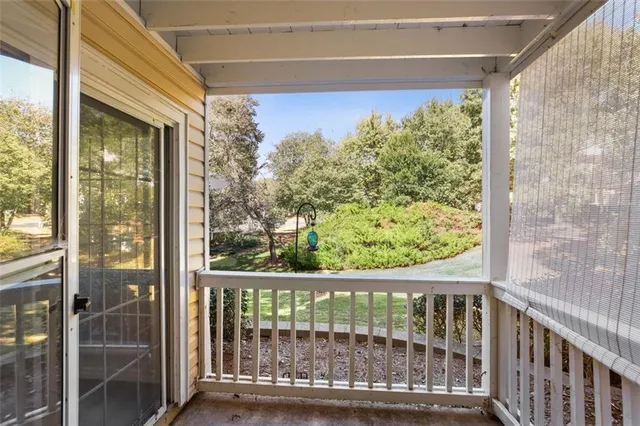 a view of balcony with furniture