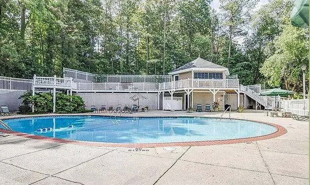 a front view of a house with swimming pool