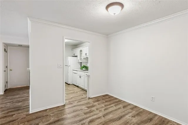 a view of a kitchen with wooden floor