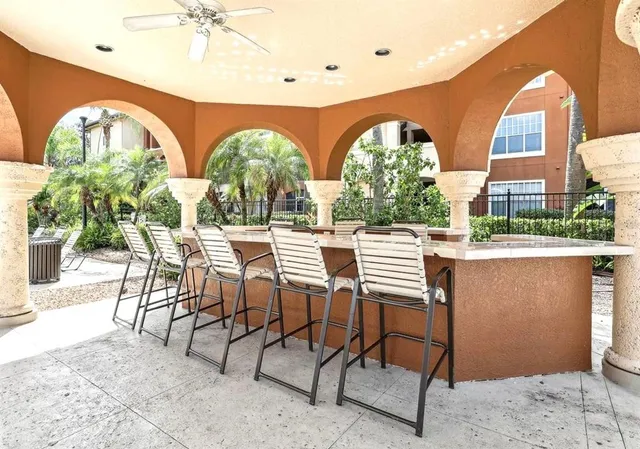 a view of a swimming pool with outdoor seating