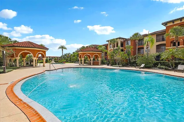 an aerial view of residential building and ocean