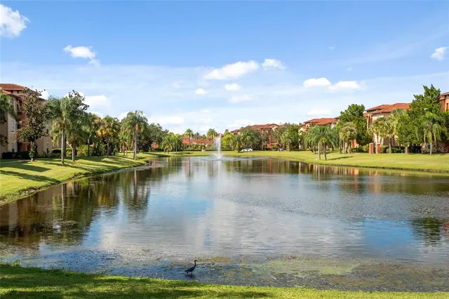 a view of a lake with houses in the background