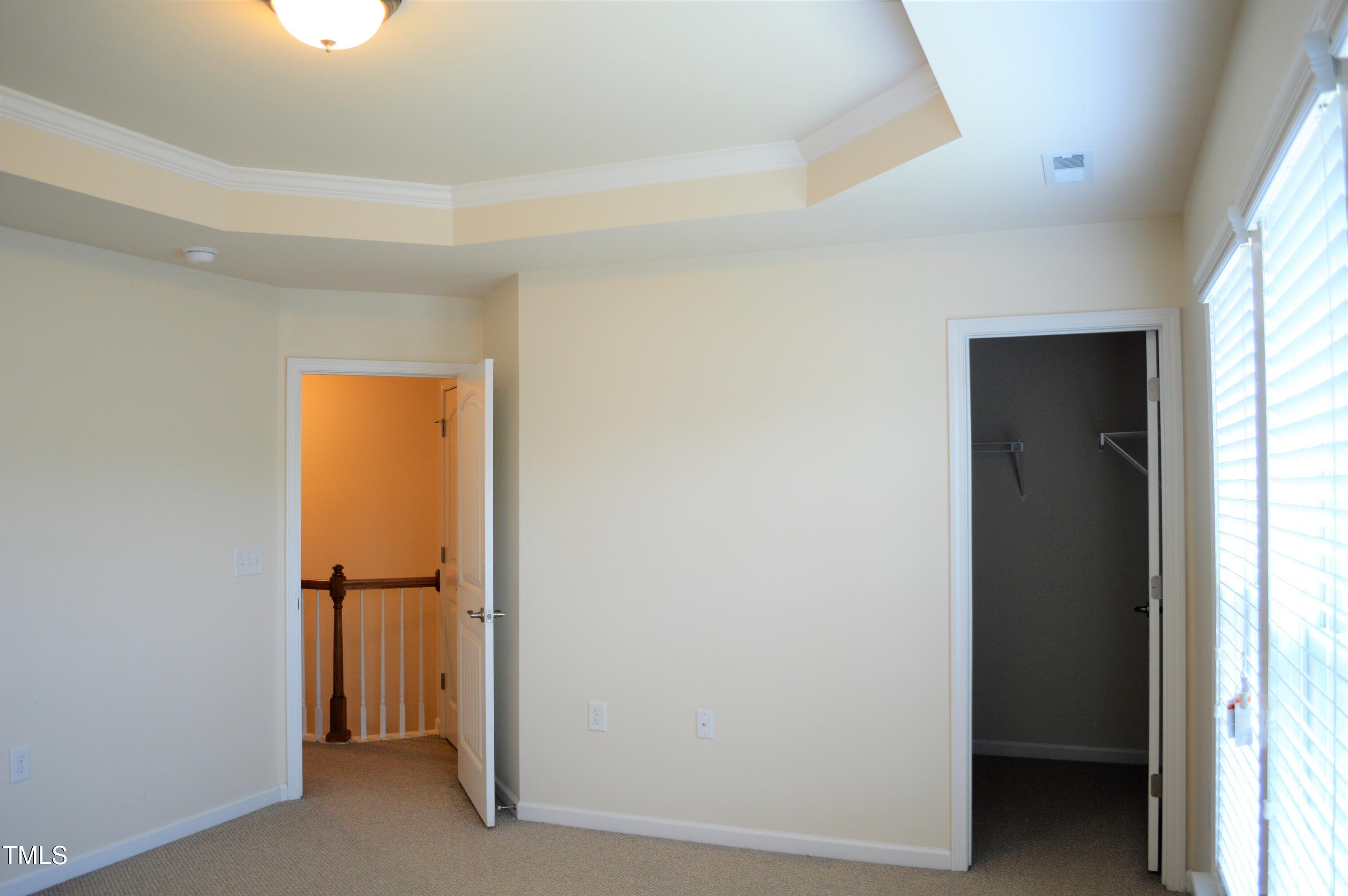127 Brier Crossings Loop Durham, NC 27703 - Photo 8 of 14 a view of walk in closet with window