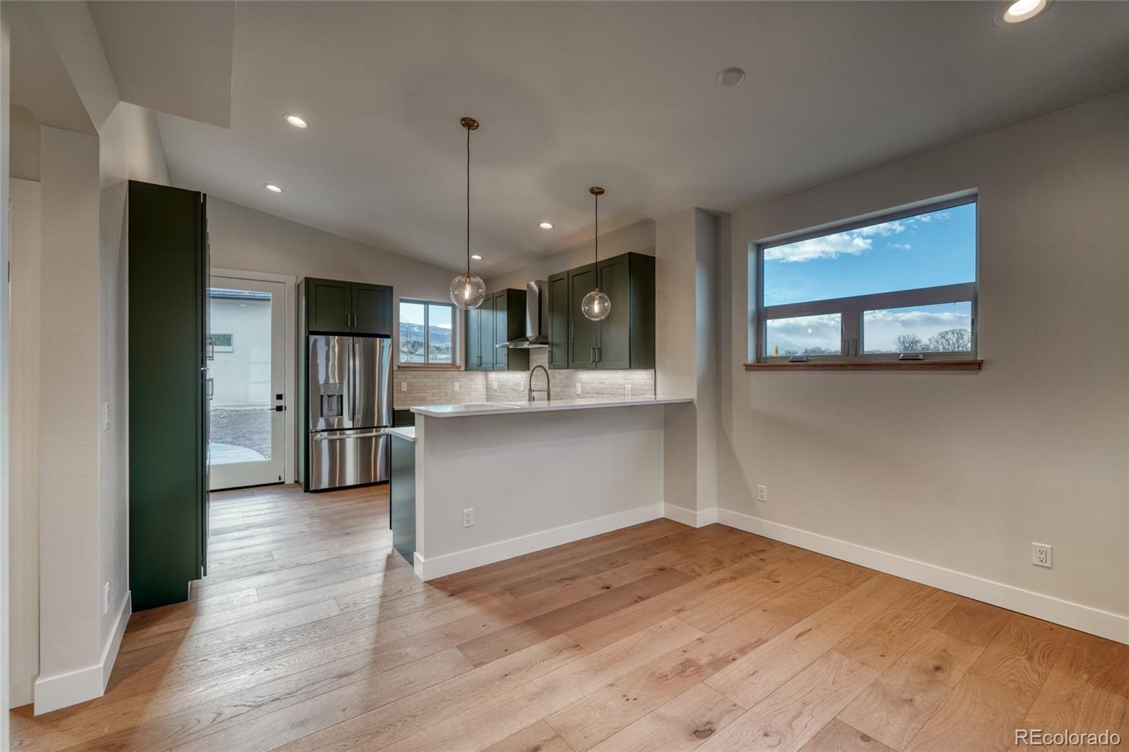211 Southside Loop Salida, CO 81201 - Photo 13 of 39 a view of a kitchen with a sink and a window