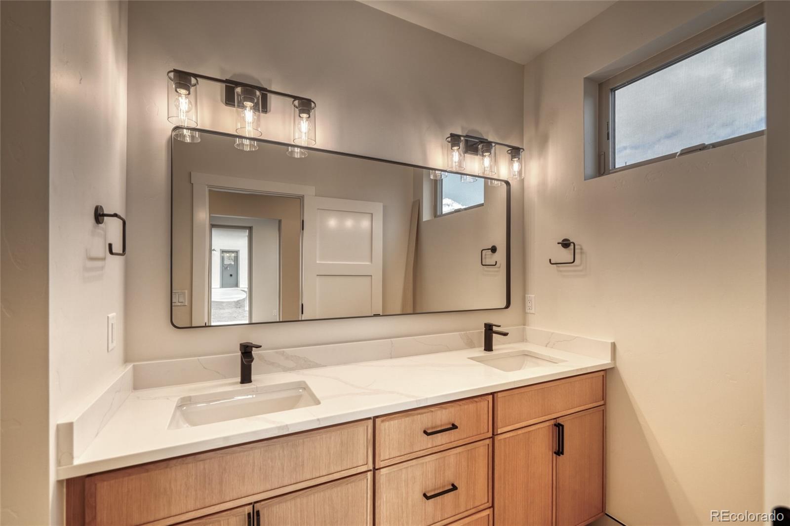 211 Southside Loop Salida, CO 81201 - Photo 23 of 39 a bathroom with a sink and a mirror