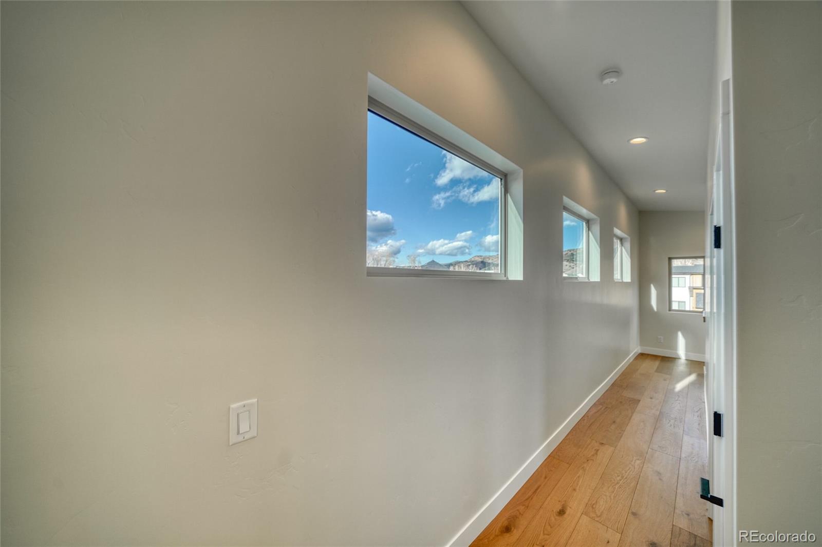 211 Southside Loop Salida, CO 81201 - Photo 28 of 39 a view of a hallway with wooden floor