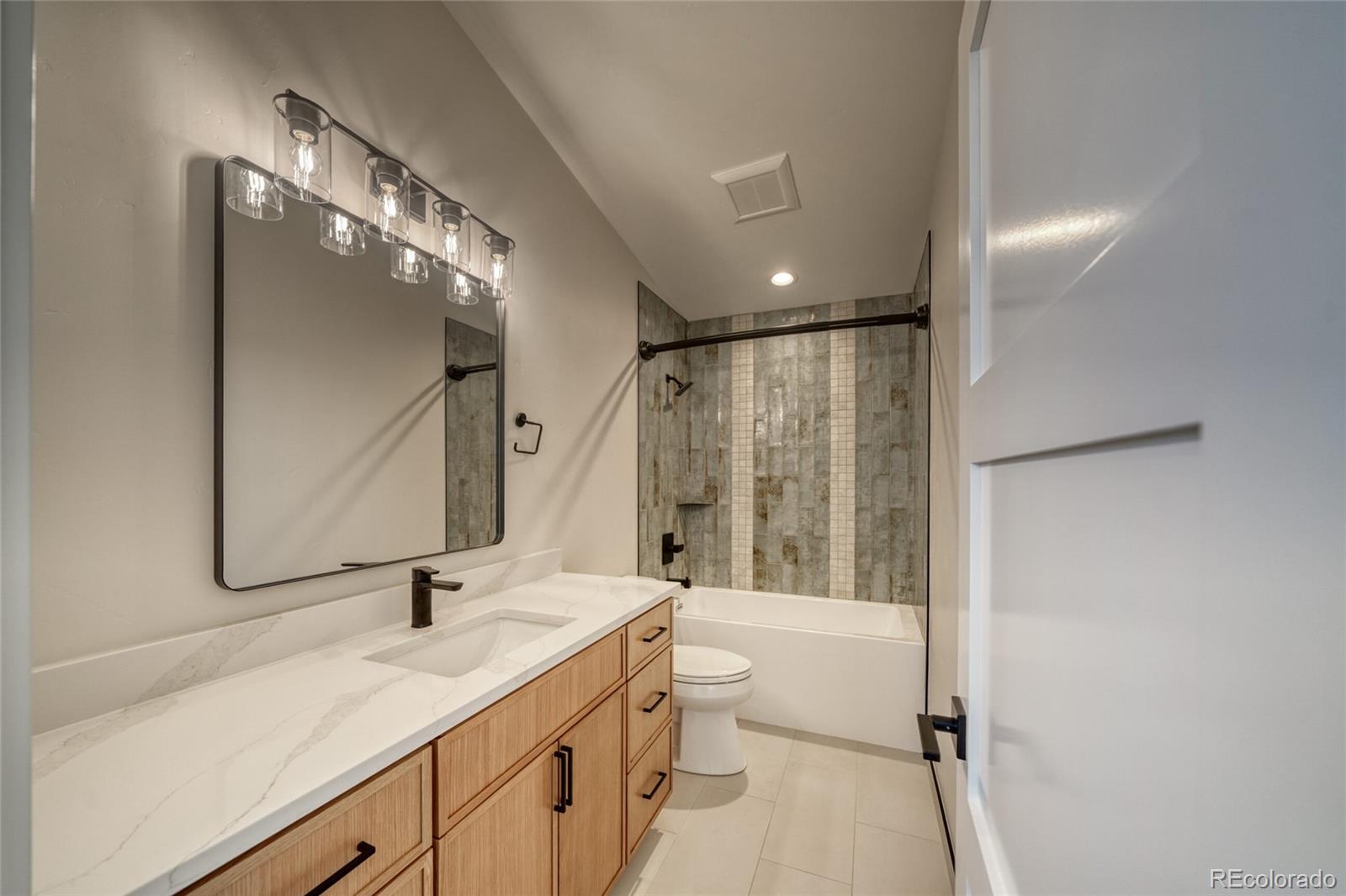 211 Southside Loop Salida, CO 81201 - Photo 31 of 39 a bathroom with a double vanity sink and mirror with shower
