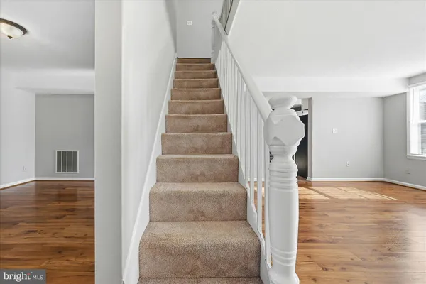 a view of entryway with wooden floor