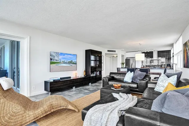 a bedroom with a bed and painting on the wall