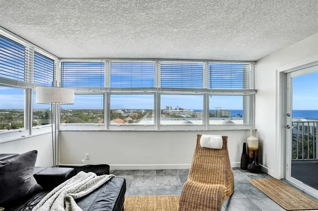 a bedroom with a bed and painting on the wall
