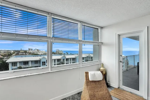 a bedroom with a bed and a painting