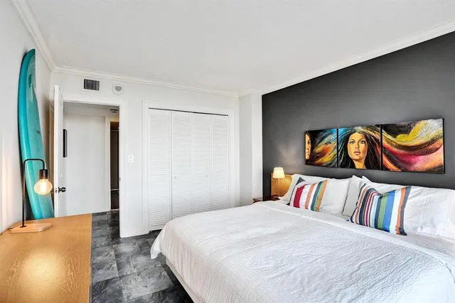 a bedroom with a bed and a dresser